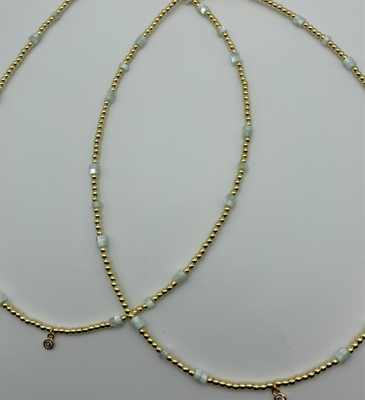 Gold Gem Necklace with Hints of Blue