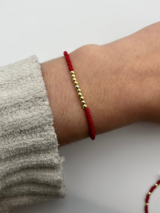 Red Bracelet with Gold Detail