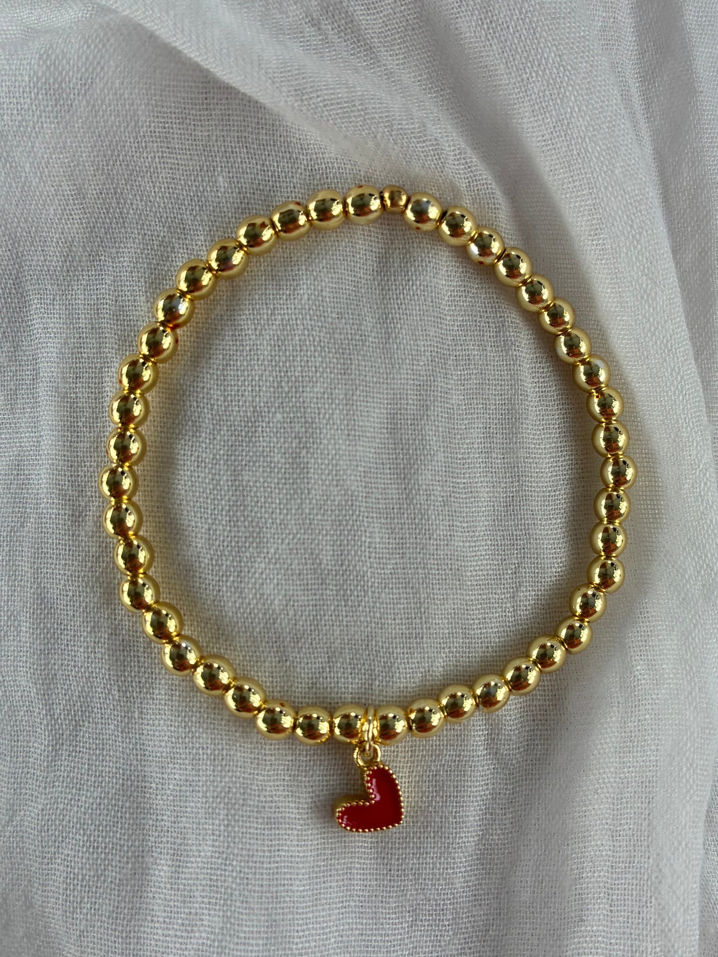 Gold Bracelet with Red Heart Charm